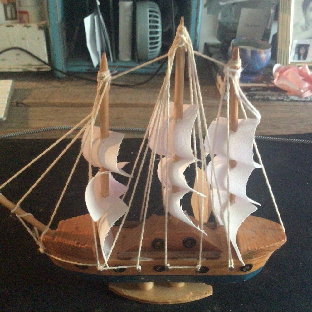 Wooden Model Ship with White Sails